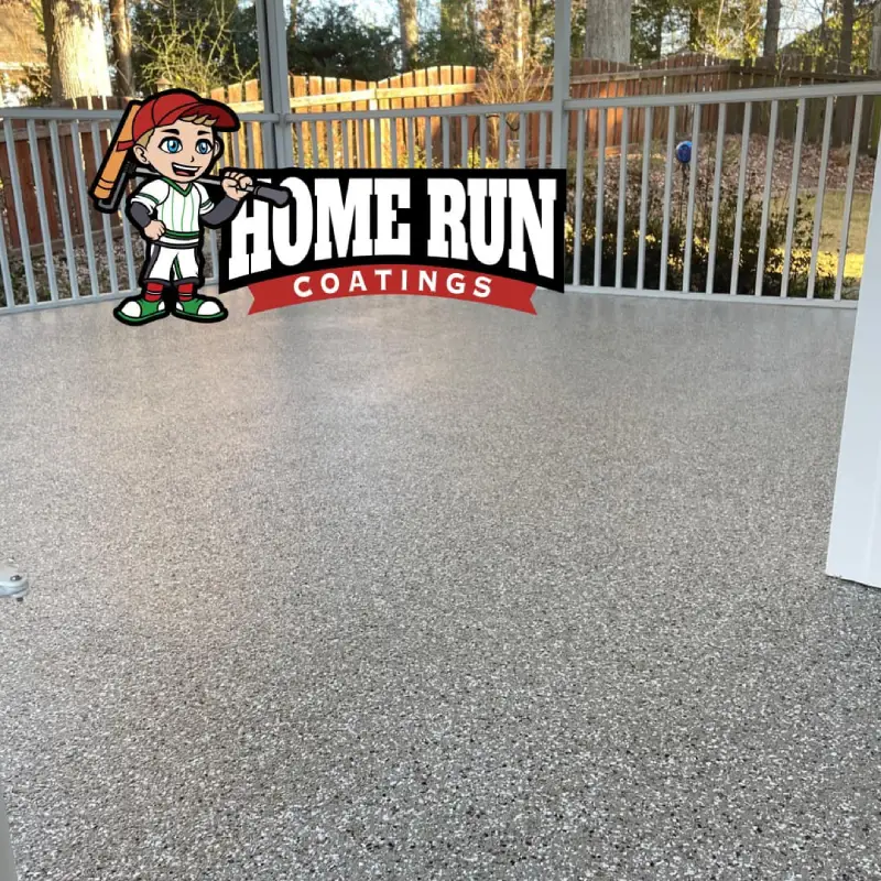 A newly coated patio floor with a glossy finish by Home Run Coatings.